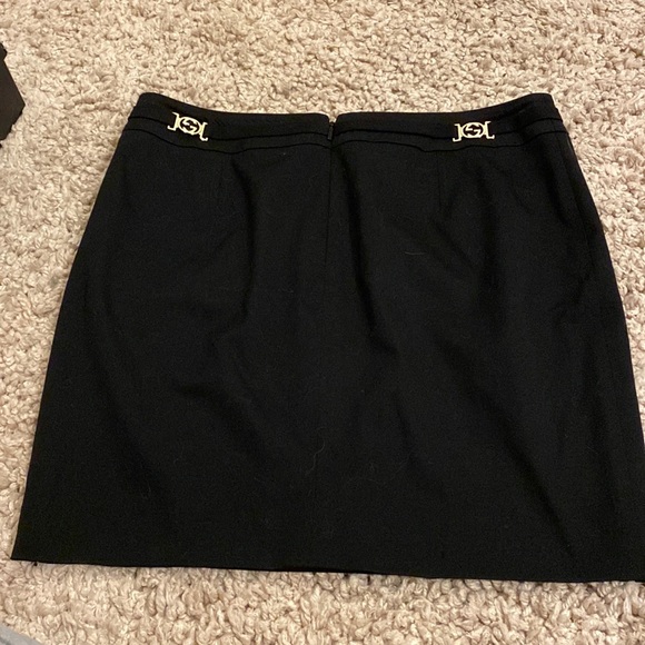 Black Gucci mini skirt with two silver GGs that rest on your back hips. With bag - Picture 2 of 10